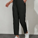 Pantalones unicolor con bolsillo oblicuo de cintura con cordon