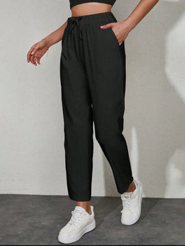 Pantalones unicolor con bolsillo oblicuo de cintura con cordon