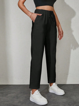 Pantalones unicolor con bolsillo oblicuo de cintura con cordon