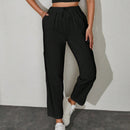 Pantalones unicolor con bolsillo oblicuo de cintura con cordon