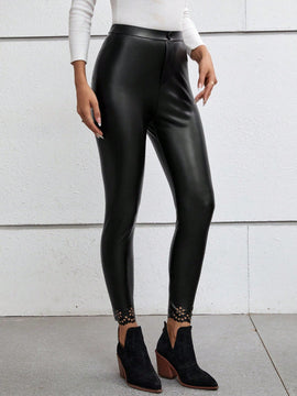 Pantalones ajustados unicolor cortado laser cuero PU