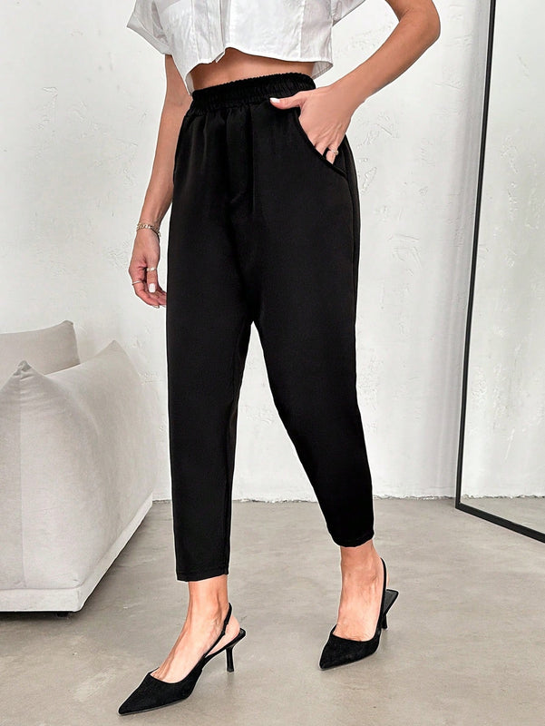 Pantalones conicos unicolor de cintura elastica