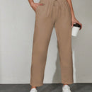 Pantalones unicolor con bolsillo oblicuo de cintura con cordon