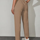 Pantalones unicolor con bolsillo oblicuo de cintura con cordon