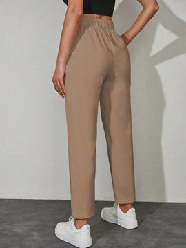Pantalones unicolor con bolsillo oblicuo de cintura con cordon