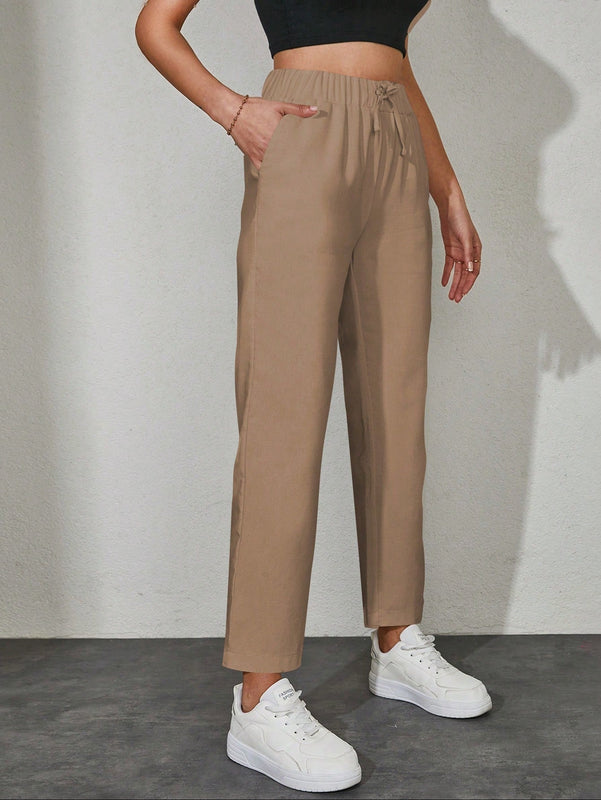 Pantalones unicolor con bolsillo oblicuo de cintura con cordon
