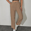 Pantalones unicolor con bolsillo oblicuo de cintura con cordon
