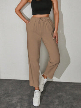 Pantalones unicolor con bolsillo oblicuo de cintura con cordon