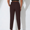 Pantalones zanahoria con bolsillo oblicuo liso
