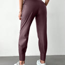 Pantalones con punos elasticos y cintura con cordon de color liso para mujer