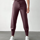 Pantalones con punos elasticos y cintura con cordon de color liso para mujer