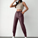 Pantalones con punos elasticos y cintura con cordon de color liso para mujer