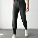 Pantalones con punos elasticos y cintura con cordon de color liso para mujer