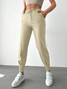 Pantalones con punos elasticos y cintura con cordon de color liso para mujer