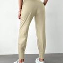 Pantalones con punos elasticos y cintura con cordon de color liso para mujer