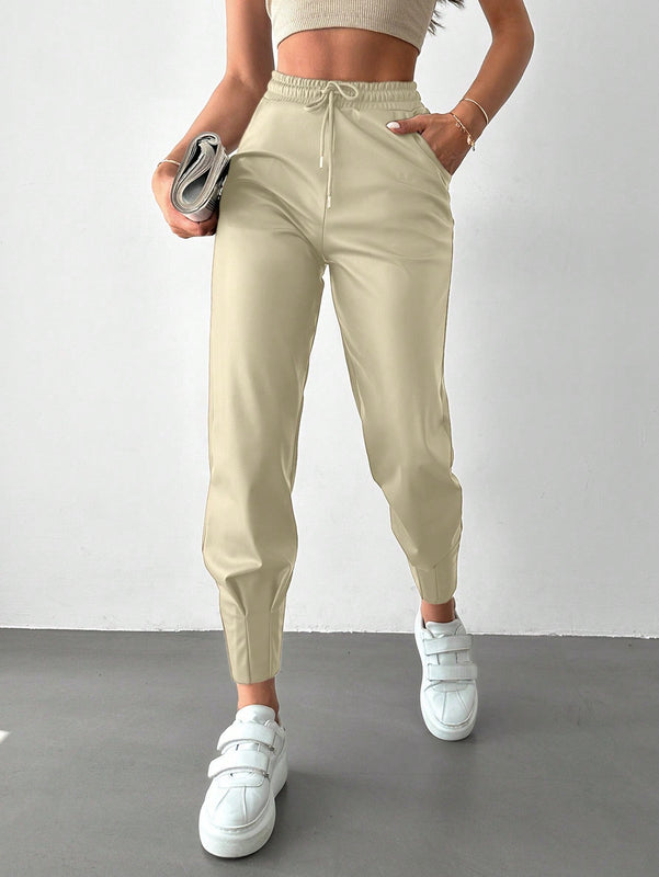 Pantalones con punos elasticos y cintura con cordon de color liso para mujer
