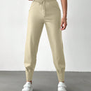Pantalones con punos elasticos y cintura con cordon de color liso para mujer