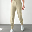 Pantalones con punos elasticos y cintura con cordon de color liso para mujer