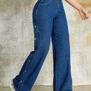 Jeans unicolor con boton lateral
