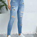 Pantalones ajustados y elasticos para mujer con detalles rasgados y estampado de estrellas