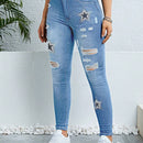 Pantalones ajustados y elasticos para mujer con detalles rasgados y estampado de estrellas