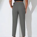 Pantalones zanahoria con bolsillo oblicuo liso