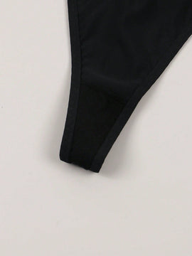 Tanga para senoras sexy y sencilla con decoracion metalica y patron impreso de letras