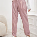 Pantalones largos de tela metalica con nudo frontal para mujer