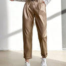 Pantalones largos de tela metalica con nudo frontal para mujer