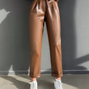 Pantalones largos de tela metalica con nudo frontal para mujer