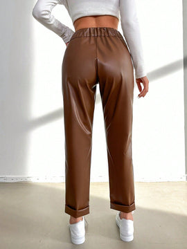 Pantalones largos de tela metalica con nudo frontal para mujer