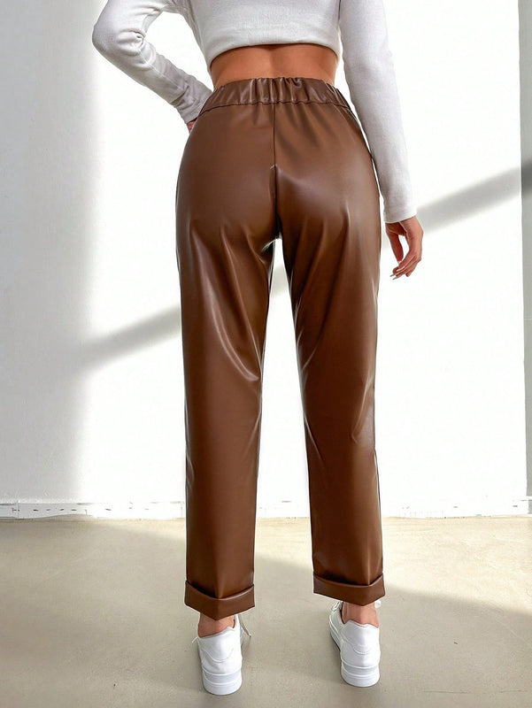 Pantalones largos de tela metalica con nudo frontal para mujer