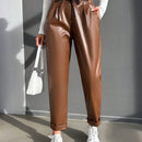 Pantalones largos de tela metalica con nudo frontal para mujer