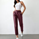 Pantalones largos de tela metalica con nudo frontal para mujer