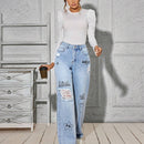 Jeans Lavados Y Desgastados Con Estampado De Carton