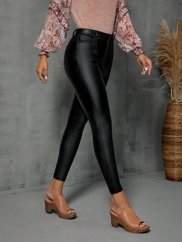 Pantalones ajustados con costura frontal en unicolor