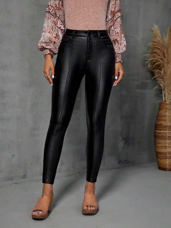 Pantalones ajustados con costura frontal en unicolor