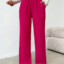 Pantalones sueltos de pierna ancha de color solido para mujer con dobladillo fluido, estilo casual