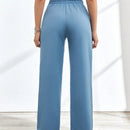 Pantalones decorados con botones cruzados para mujer