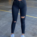 Jeans negros ajustados para mujer con rasgaduras y longitud del tobillo