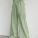 Pantalones sueltos de pierna ancha de color solido para mujer con dobladillo fluido, estilo casual