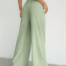 Pantalones sueltos de pierna ancha de color solido para mujer con dobladillo fluido, estilo casual