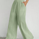 Pantalones sueltos de pierna ancha de color solido para mujer con dobladillo fluido, estilo casual