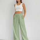 Pantalones sueltos de pierna ancha de color solido para mujer con dobladillo fluido, estilo casual