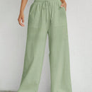 Pantalones sueltos de pierna ancha de color solido para mujer con dobladillo fluido, estilo casual