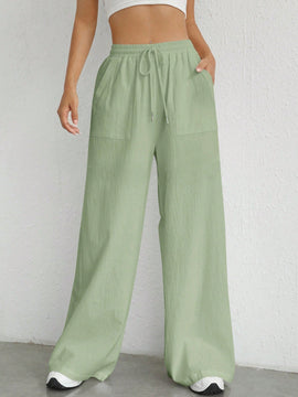 Pantalones sueltos de pierna ancha de color solido para mujer con dobladillo fluido, estilo casual