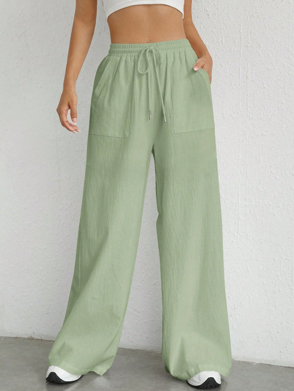 Pantalones sueltos de pierna ancha de color solido para mujer con dobladillo fluido, estilo casual