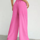 Pantalones sueltos de pierna ancha de color solido para mujer con dobladillo fluido, estilo casual