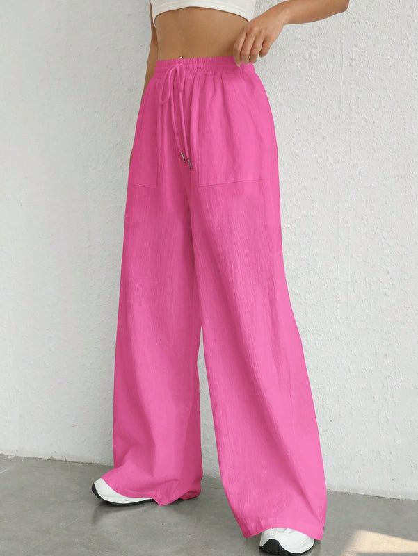 Pantalones sueltos de pierna ancha de color solido para mujer con dobladillo fluido, estilo casual