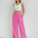 Pantalones sueltos de pierna ancha de color solido para mujer con dobladillo fluido, estilo casual